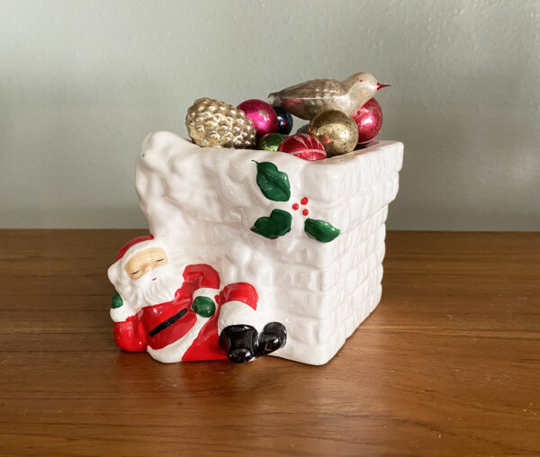 Vintage ceramic Christmas planter featuring a sleeping Santa in front of a chimney. In perfect condition Ocean Bridge Ceramics Hayward California. A great candy cane box christmas decor.