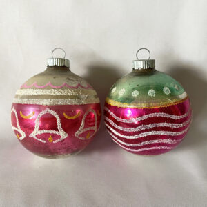 Two vintage Shiny Brite glass ornaments with white mica decoration, one with bells and the other with stripes and dots, wonderful USA glass ornaments from the 1950s.