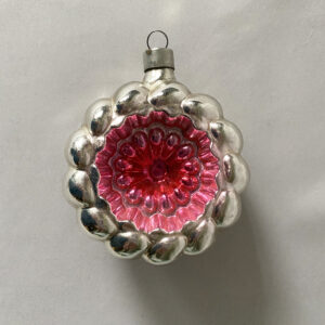 Striking pink and silver bumpy indent wreath Christmas ornament made by Heidt, a German USA ornament make circa 1930s.