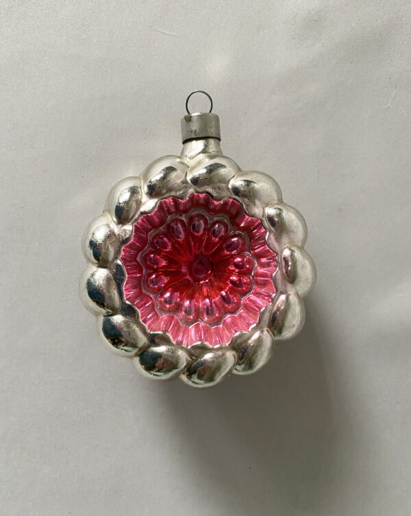 Striking pink and silver bumpy indent wreath Christmas ornament made by Heidt, a German USA ornament make circa 1930s.