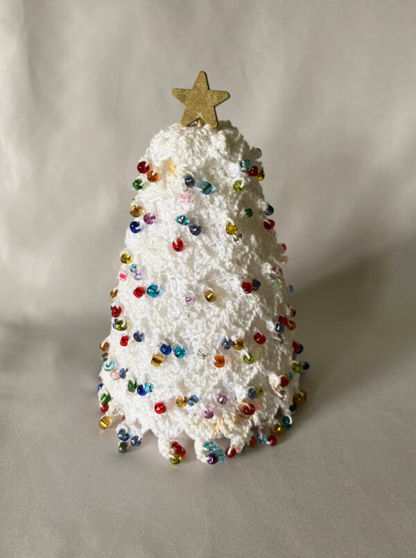vintage white crochet christmas tree decoration with colorful glass beads and wood star topper, handmade mid century christmas decor
