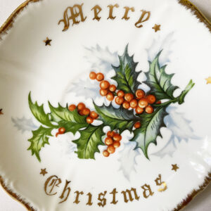 Vintage Norcrest porcelain small Merry Christmas decor plate with holly berry transferware design and gilt accents, 1960s.