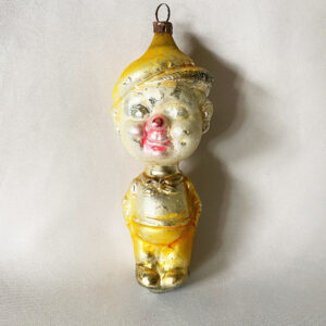 1920s German figural glass ornament comic character Smitty, 4.5 inches tall with yellow pants and hat, excellent.