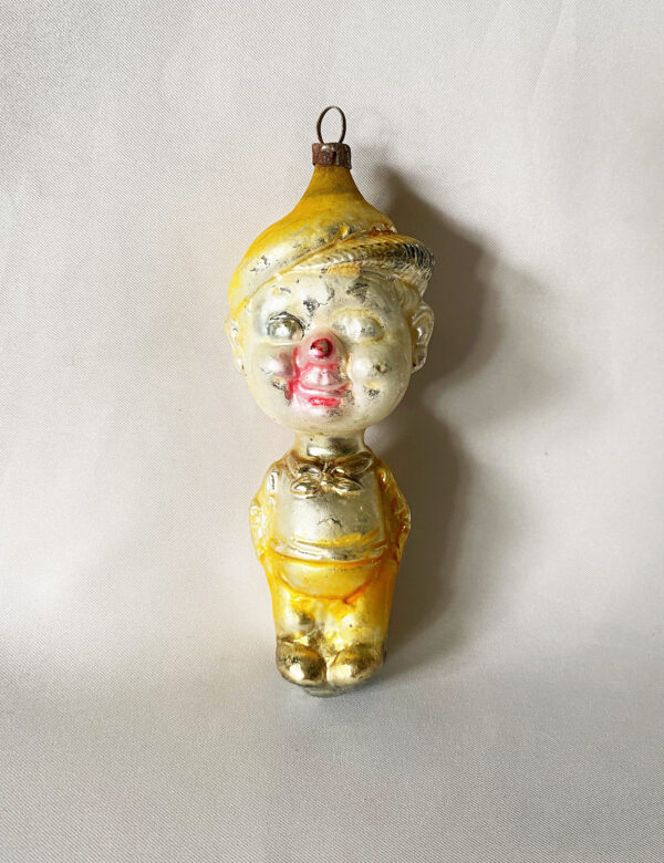 1920s German figural glass ornament comic character Smitty, 4.5 inches tall with yellow pants and hat, excellent.