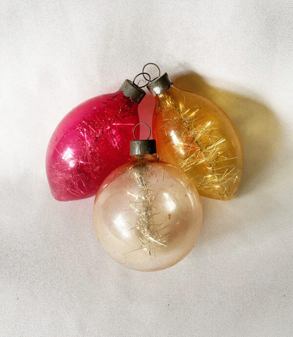 Three Corning 1940s War Era unsilvered glass Christmas ornaments with tinsel inside, two teadrops with color and one clear sphere, excellent.