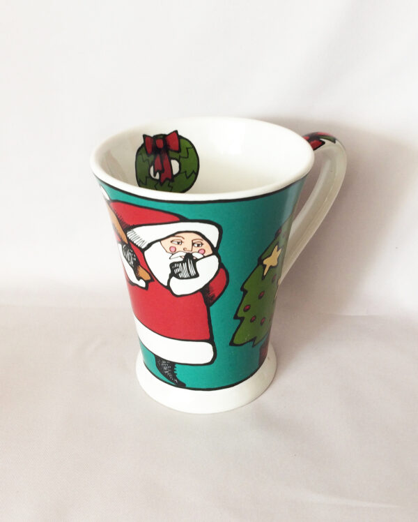 Ursula Dodge retired Christmas coffee cup Santa and Sleeping Boy waiting for Santa ceramic Signature Housewares mug cup.