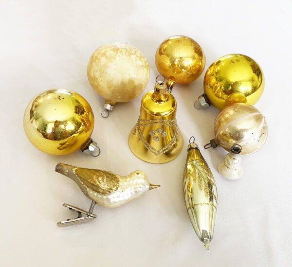 Lot of nine vintage gold mercury glass christmas ornaments five round two bells one icicle one bird, some glitter ornaments, mid century.