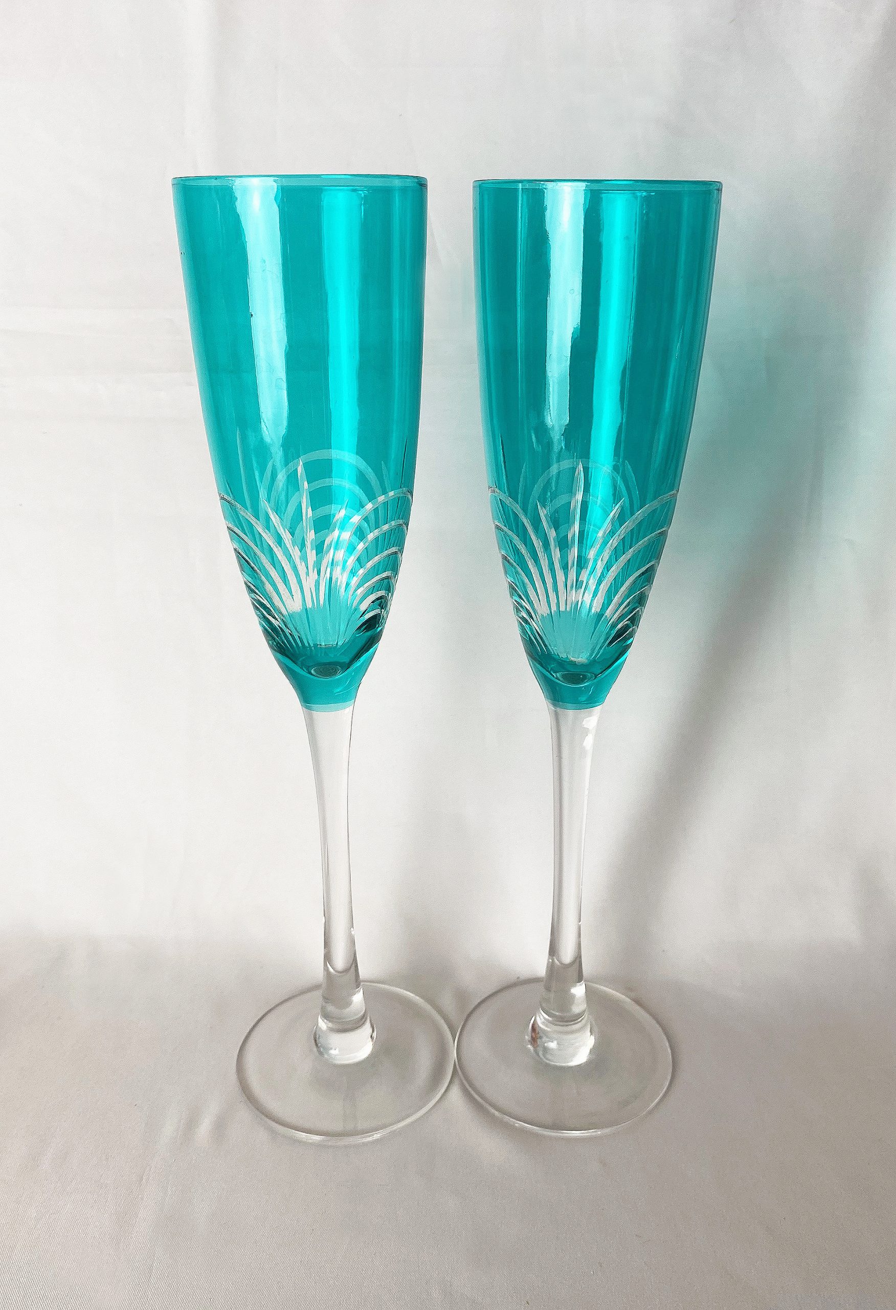 https://www.justvintagechristmas.com/wp-content/uploads/2023/11/XM2012-cut-crystal-champagne-flutes-vintage-champagne-toasting-glasses-blue-green-christmas-stemware-pair-just-vintage-christmas-1-scaled.jpg